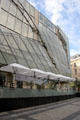Drugstore Publicis modern glass facade detail at Champs Elysees. Paris, France.