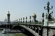 Alexandre III bridge built for 1900 World Exposition as a single span steel arch plus Les Invalides beyond. Paris, France.