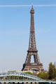 Eiffel Tower over Seine Rouelle rail bridge. Paris, France.