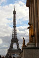 Eiffel Tower seen beyond sculptures of Palais de Chaillot on Trocadero Hill. Paris, France.