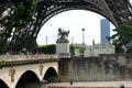 Roman warrior statue by Louis-Joseph Daumas on Pont d'Iéna with Eiffel Tower beyond. Paris, France.