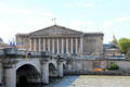 National Assembly part of French Parliament meets in former Palais Bourbon seen from Place de la Concorde across River Seine. Paris, France.