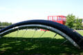 Tire of Buried Bicycle sculpture by Claes Oldenburg at Parc de la Villette. Paris, France.