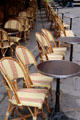 Chairs at sidewalk cafe in Paris. Paris, France