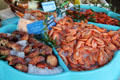 Crab claws & shrimp selections at seafood shop. Paris, France.