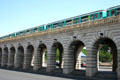 RATP metro train on viaduct bridge over Seine. Paris, France