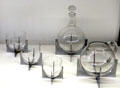 Elements of Paraison glass drinks service on chrome frames by Baccarat at Museum of Decorative Arts. Paris, France.