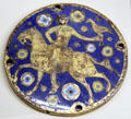 Enameled copper medallion of falconer on horseback from Limoges at Cluny Museum. Paris, France.