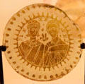 Gold image of married couple on glass base of cup at Petit Palace Museum. Paris, France.
