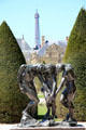 Three shades bronze sculpture by Auguste Rodin with Eiffel Tower beyond at Rodin Museum Garden. Paris, France.