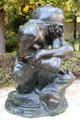 Fallen Caryatid with Urn bronze sculpture by Auguste Rodin at Rodin Museum Garden. Paris, France.