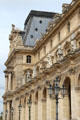 Statues of French notable historic persons on facade of Louvre Palace. Paris, France.