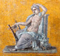 Seated Apollo wall fresco from Pompeii estate of Julia Felix at Louvre Museum. Paris, France