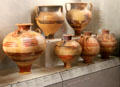 Collection of Greek terracotta tall-stem urns mostly from Rhodes at Louvre Museum. Paris, France.