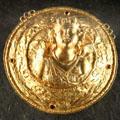 Gold medallion of Eros at Louvre Museum. Paris, France.