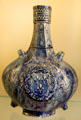 Ceramic pilgrim's flask with arms of France from Nevers, France at Sèvres National Ceramic Museum. Paris, France.