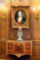 Portrait & lyre clock over cabinet in parlor at Cognacq-Jay Museum. Paris, France