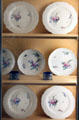 Chantilly porcelain plates with flowers at Nissim de Camondo Museum. Paris, France.