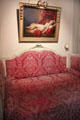 Alcove bed under portrait of Mlle Duthé by Henri-Pierre Danloux in bedroom at Nissim de Camondo Museum. Paris, France.