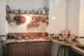 Molds & copper cooking pots in kitchen at Nissim de Camondo Museum. Paris, France.