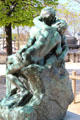 The Kiss by Auguste Rodin in front of Orangerie museum. Paris, France.