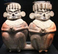 Chancay culture terra cotta funerary vases of seated couple from Peru at Musée du quai Branly. Paris, France.