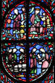 King with subjects stained glass scene at St Chapelle. Paris, France.