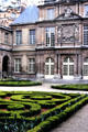 Courtyard with facing facade saved from historic building at Carnavalet Museum. Paris, France.