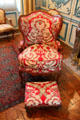 Walnut armchair & footstool upholstered with 18thC designs at Carnavalet Museum. Paris, France.
