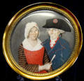 Elderly couple in Revolutionary dress with rosettes painting on ivory at Carnavalet Museum. Paris, France.