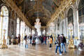 Visitors in Hall of Mirrors at Versailles Palace. Versailles, France