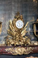 Clock to glory of Louis XIV by clockmaker Martinot & bronze craftsman Gallien in Council Study at Versailles Palace. Versailles, France.