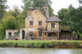 Mill with waterwheel at Marie Antoinette farm. Versailles, France