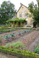 Fall garden with rustic building at Marie Antoinette farm. Versailles, France.