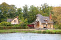 Rustic buildings of Marie Antoinette farm where Queen played at being farmer. Versailles, France.
