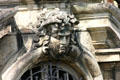 Head carved into stonework over window at Château de Chantilly. Chantilly, France.