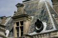 Ornate dormer window & slate roof at Château de Chantilly. Chantilly, France.