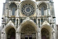 Deep porches with Last Judgment topped by statues & rose window of Cathédrale Notre-Dame. Laon, France.