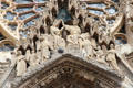 Coronation of Virgin Mary carving by Georges Saupique in central portal of Reims Cathedral. Reims, France.