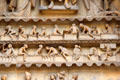 Dead rising from tombs in Last Judgment scene on Reims Cathedral. Reims, France.