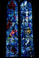 Christ Crucified over scenes of Abraham, Isaac & Jacob detail on Chagall stained glass window at Reims Cathedral. Reims, France.