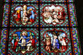 Stained glass window with scenes from life of St. Louis in Notre Dame Cathedral. Senlis, France.