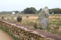 Stone wall surrounding menhirs site. Carnac, France.