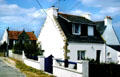 Typical Brittany dwellings alongside road. Carnac, France.