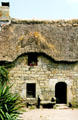 Brittany stone dwelling with thatched roof. Carnac, France.