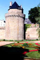 Round tower & walls of Vannes over moat garden. Vannes, France.
