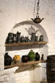 Pewter pitchers & stoneware vessels in kitchen at Jacques Cartier Manor House Museum. St Malo, France.