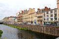 Buildings lining La Vilaine River. Rennes, France.