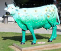 Cow painted with flowers in town of La Caserne, gateway to Mont-St-Michel. Mont-St-Michel, France.