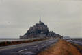 Former causeway access to Mont-St-Michel with risky parking lots on tidal flats. Mont-St-Michel, France.
